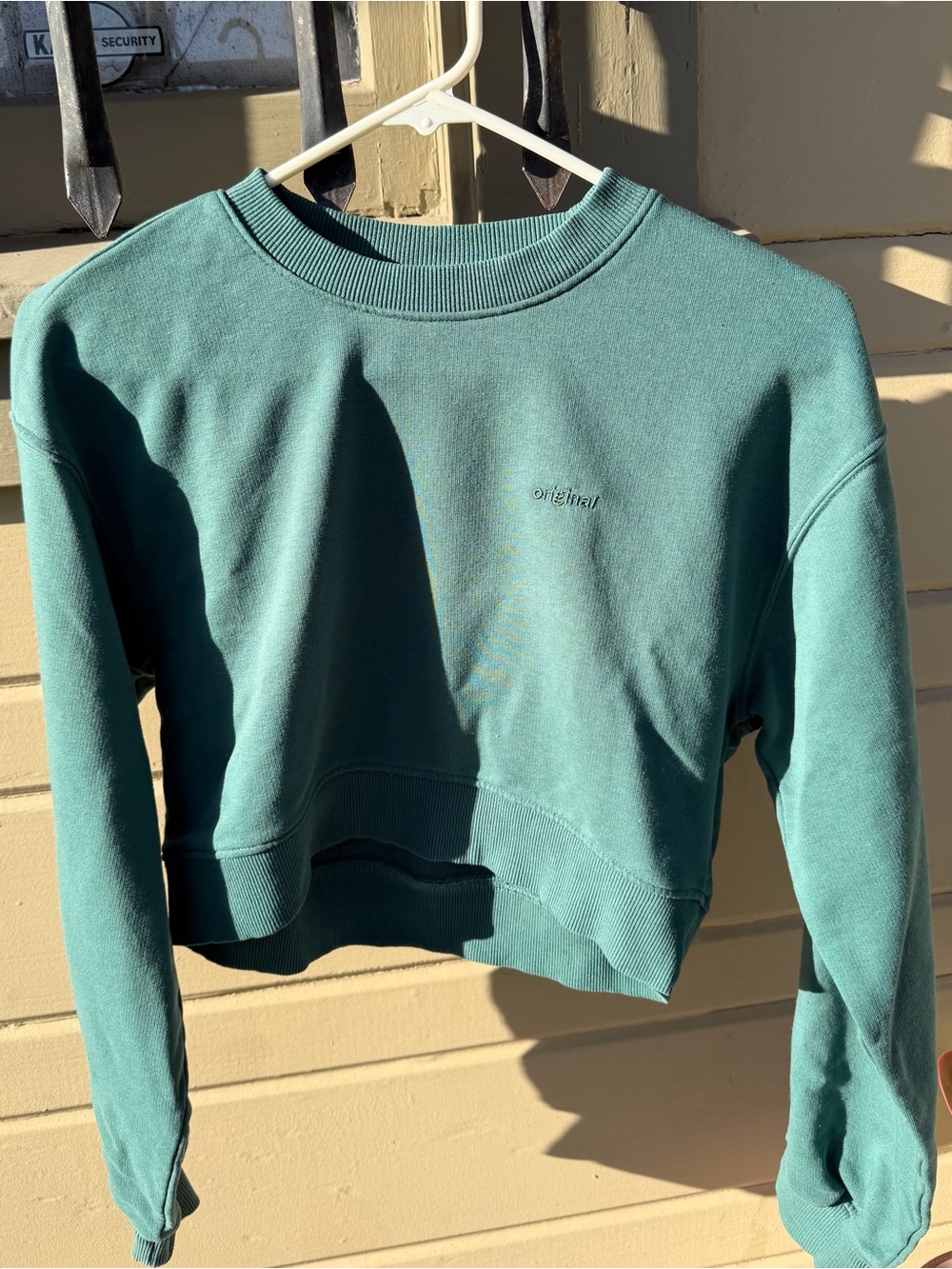 Divided Teal Cropped Crewneck Sweatshirt